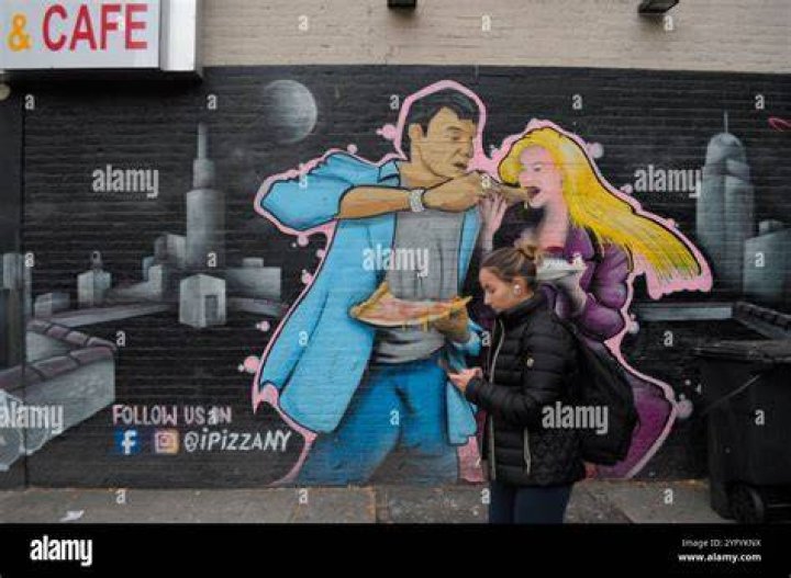 A person walks past a graffito showing late George Floyd, in Berlin, Germany, 30 May 2020. A bystander's video posted online on 25 May, appeared to show George Floyd, 46, pleading with arresting officers that he couldn't breathe as an officer knelt on his neck in Minneapolis, Minnesota. The unarmed black man later died in police custody. A series of demonstrations throughout the German capital, calling for ending of the social and economical restrictions imposed due to the coronavirus pandemic. The events are organised by groups of various motives, right wing activists, conspiracy theory believers and more, several counter demonstrations by left leaning organisations were also taking place. Anti-restrictions protests and counter demos in Berlin, Germany - 30 May 2020