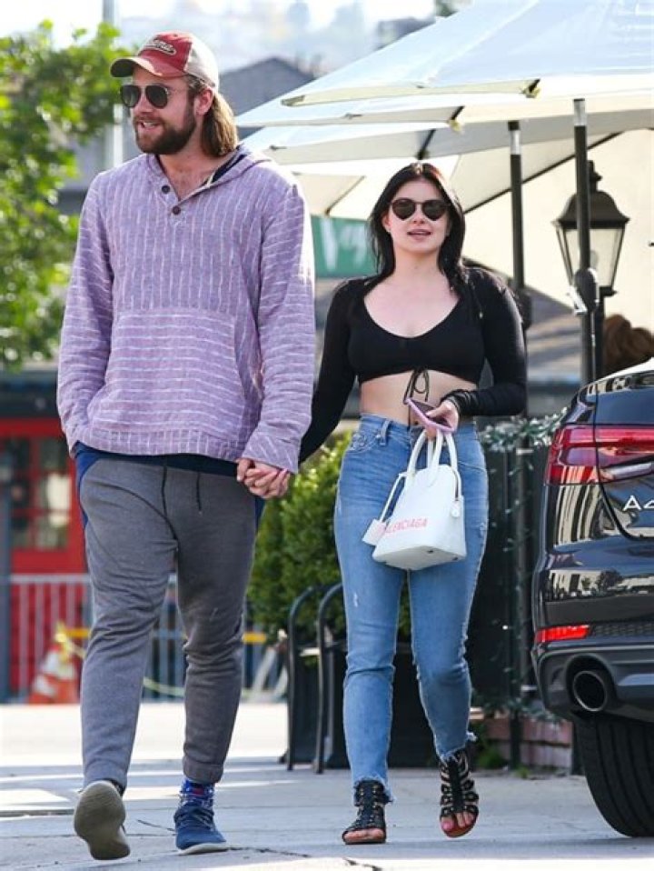 Ariel Winter holds hands with Luke Benward