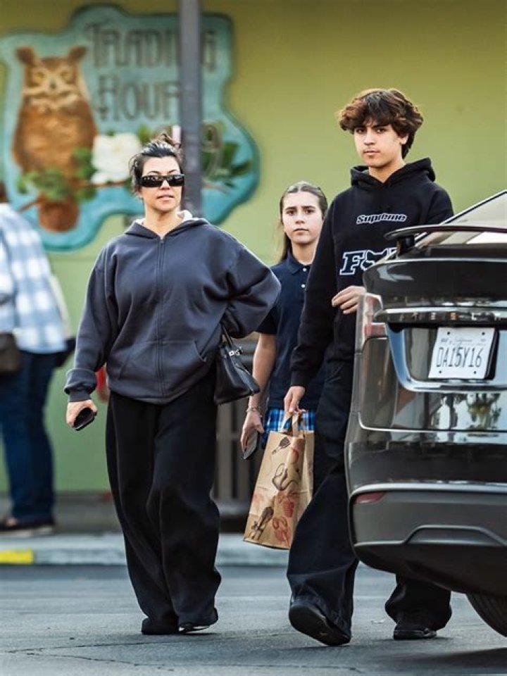 Calabasas, CA - *EXCLUSIVE* - Kourtney Kardashian looked like 'death' wearing a skeleton jumper as she stepped out makeup-free with her daughter Penelope Disick for a healthy smoothie from Sunlife Organics in Calabasas. Pictured: Kourtney Kardashian, Penelope Disick BACKGRID USA 16 MAY 2022 BYLINE MUST READ: IXOLA / BACKGRID USA: +1 310 798 9111 / UK: +44 208 344 2007 / *UK Clients - Pictures Containing Children Please Pixelate Face Prior To Publication*