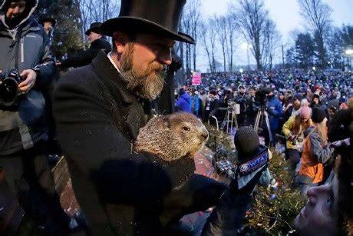 John Griffiths Al Dereume. Groundhog Club co-handler Al Dereume, second from right, holds Punxsutawney Phil, the weather prognosticating groundhog, during the 133rd celebration of Groundhog Day on Gobbler's Knob in Punxsutawney, Pa. . Phil's handlers said that the groundhog has forecast an early spring Groundhog Day, Punxsutawney, USA - 02 Feb 2019