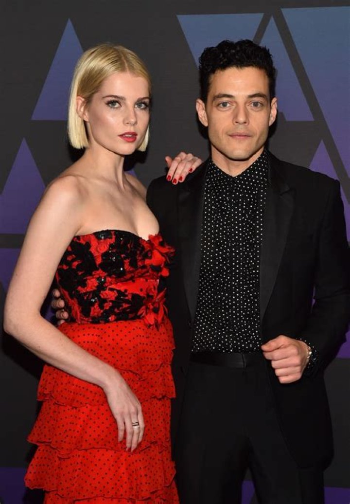 Lucy Boynton and Rami Malek attend a NHL game
