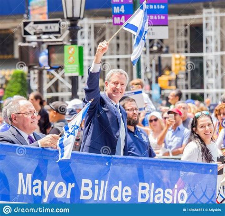 Mayor Bill de Blasio, third from left, participates in painting Black Lives Matter on Fifth Avenue in front of Trump Tower, in New York. The mayor's wife, Chirlane McCray, is fourth from left and Rev. Al Sharpton is second from left Racial Injustice , New York, United States - 09 Jul 2020
